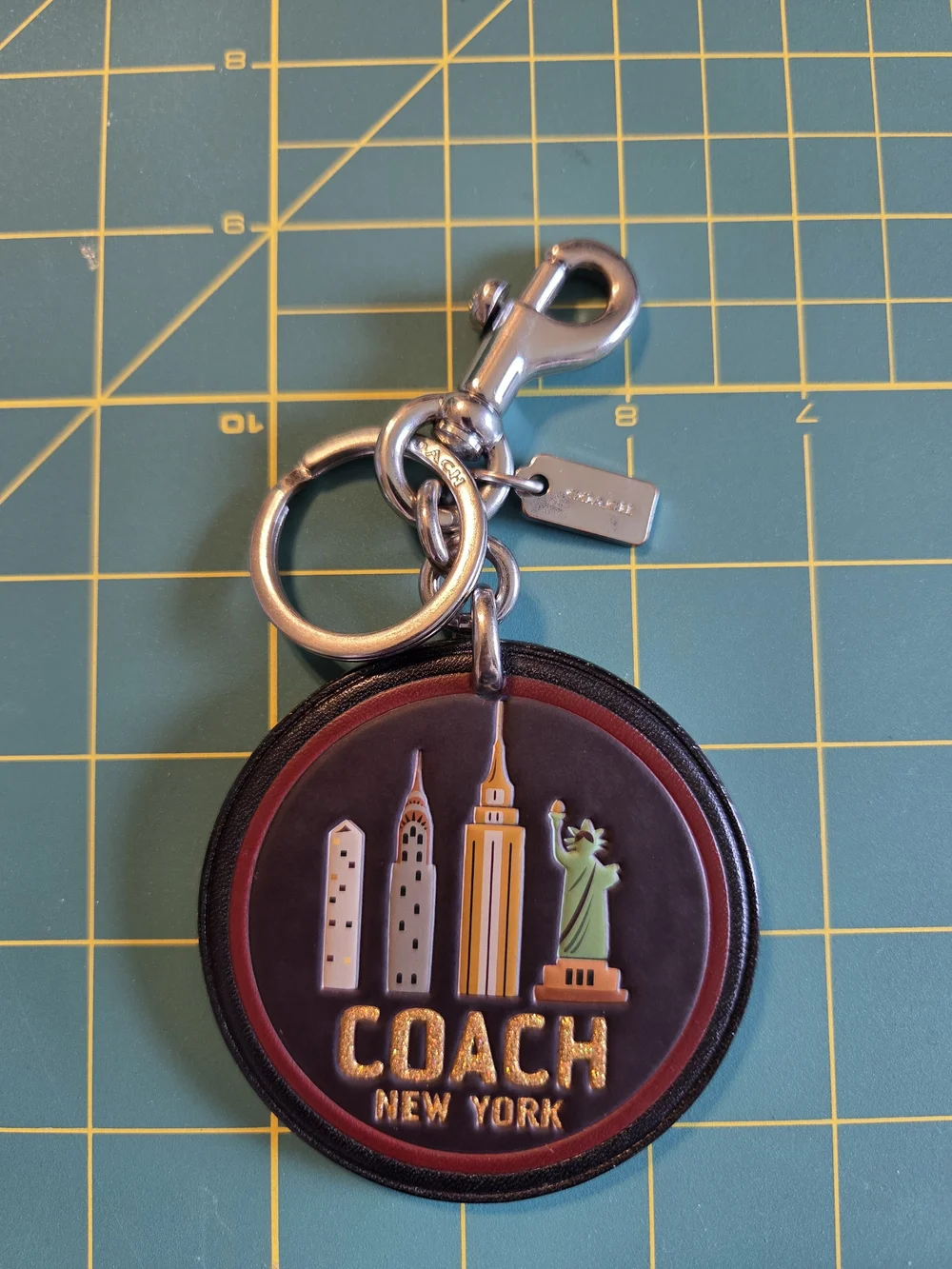 COACH New York Round Leather Keychain - Black with Gold Accents